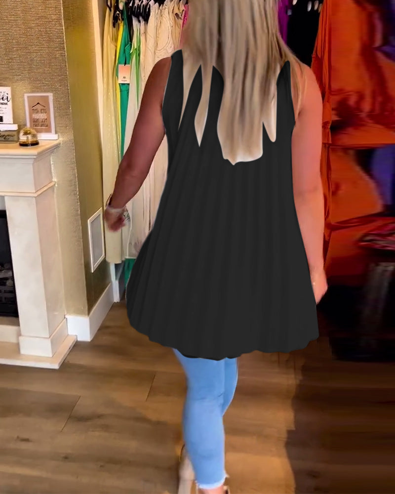 Ermeløs topp med volanger og revers