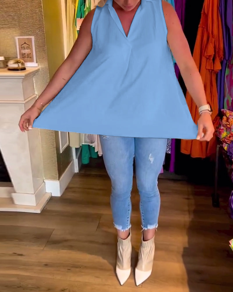 Ermeløs topp med volanger og revers