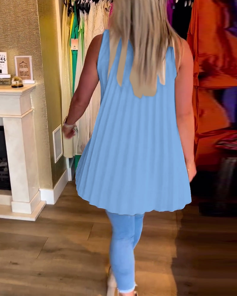 Ermeløs topp med volanger og revers