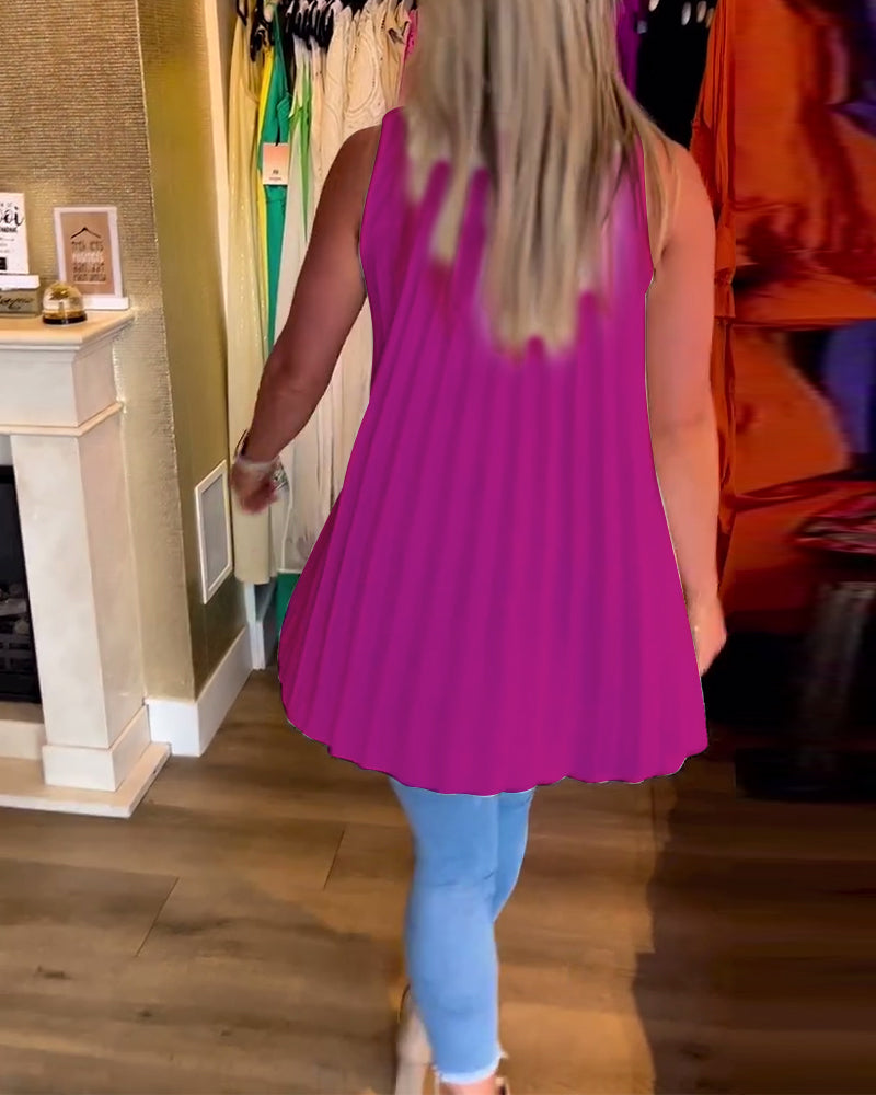 Ermeløs topp med volanger og revers