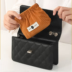 Organisator for elastiske hårbånd i kordfløyel