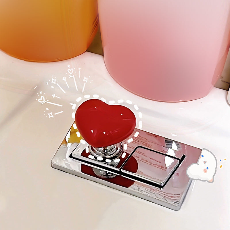 Hjerteformet toalettknapp